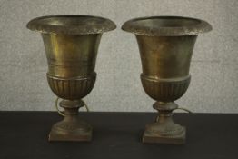Two early 20th century cast iron Classical urns converted into uplighters. H.35 Dia.30cm. (each)