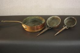Three 19th century brass and copper pans. H.8 Dia.26cm. (largest)