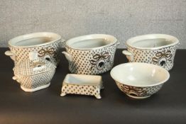 A collection of Moyses Stevens ceramics, including three cache-pots, a lidded dish, bowl and soap