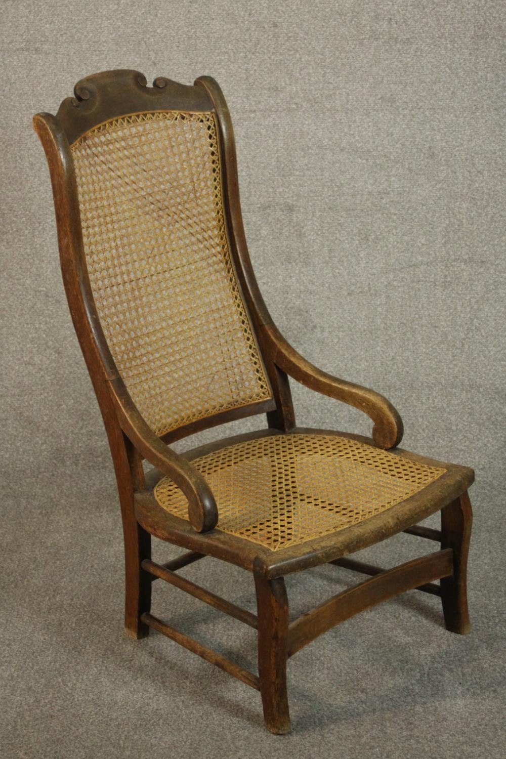 A circa 1900 hardwood nursing chair, with a caned seat and back, the legs joined by stretchers. - Image 3 of 7