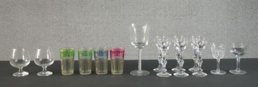 A collection of 19th and 20th century glasses including a set of six faceted stem liqueur glasses,