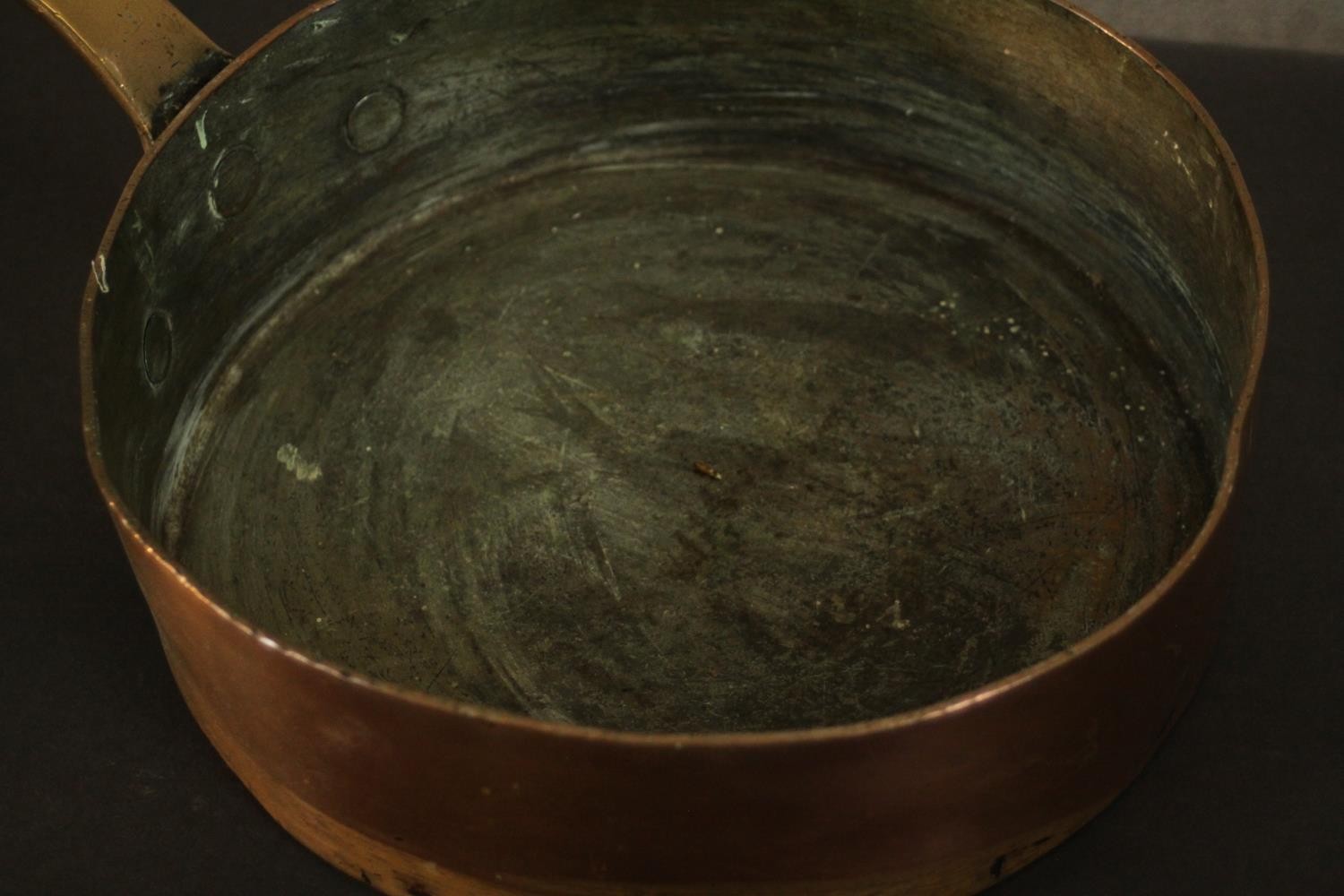 Three 19th century brass and copper pans. H.8 Dia.26cm. (largest) - Image 5 of 10