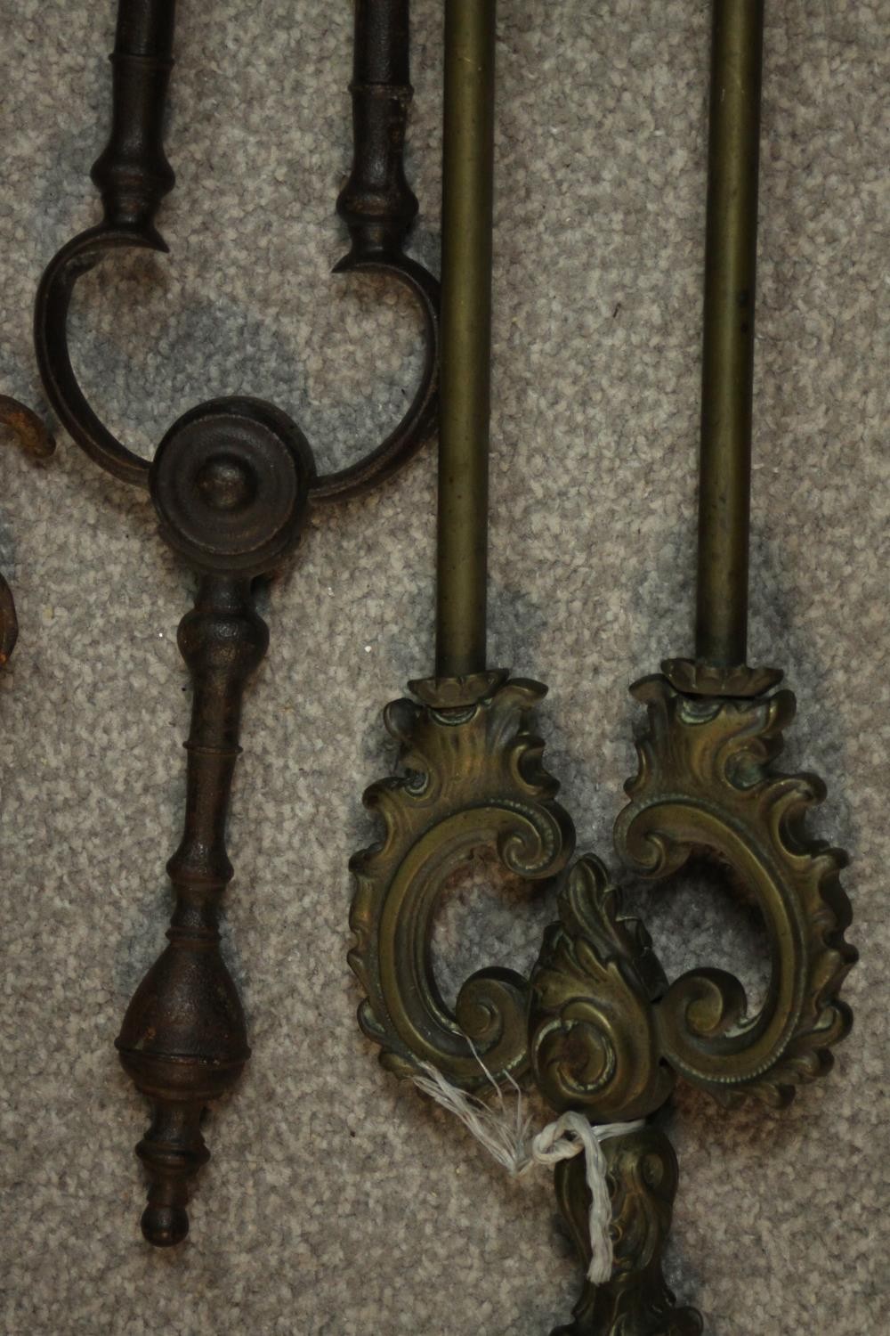 A collection of early 20th century cast iron and brass fire irons, other tools and a cast iron three - Image 5 of 7