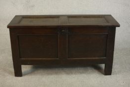 An 18th century oak coffer of panelled construction, with a candle box to the interior. H.69 w.130