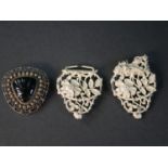 A white metal (tests as silver) early 20th century pierced nurses buckle with wild rose and