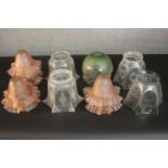A collection of twelve Victorian etched glass lamp shades, including a set of six peach glass ripple
