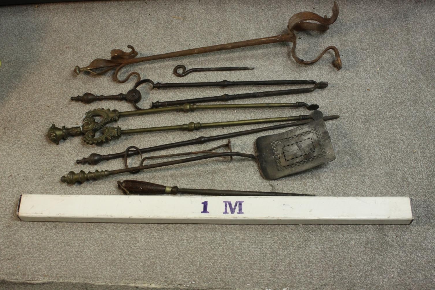 A collection of early 20th century cast iron and brass fire irons, other tools and a cast iron three - Image 2 of 7