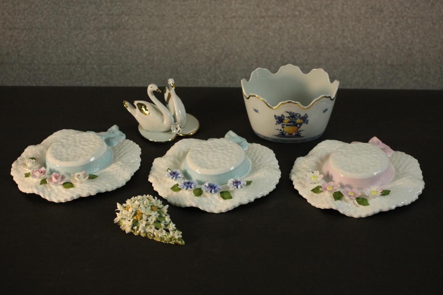 A collection of ceramics and porcelain including, three Aynsley summer hats with relief flower