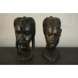 Two large mid century heavy carved African Tribal hardwood heads of warriors, one male and one