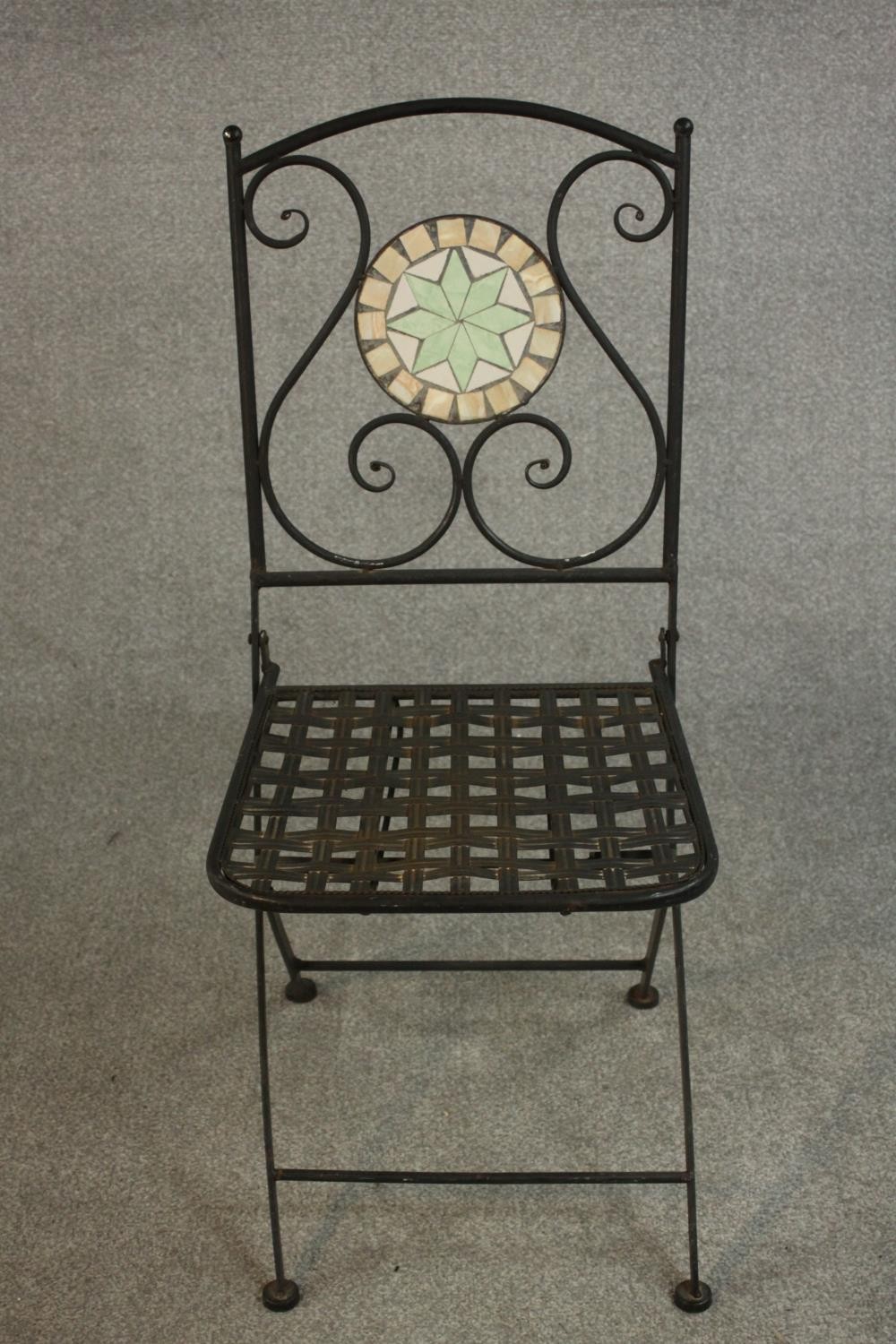 A wrought iron folding chair, the back with circular mosaic, over a slatted seat. - Image 2 of 7