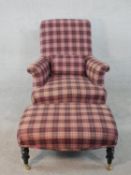 A Victorian style armchair in tartan upholstery on ebonised turned supports along with the