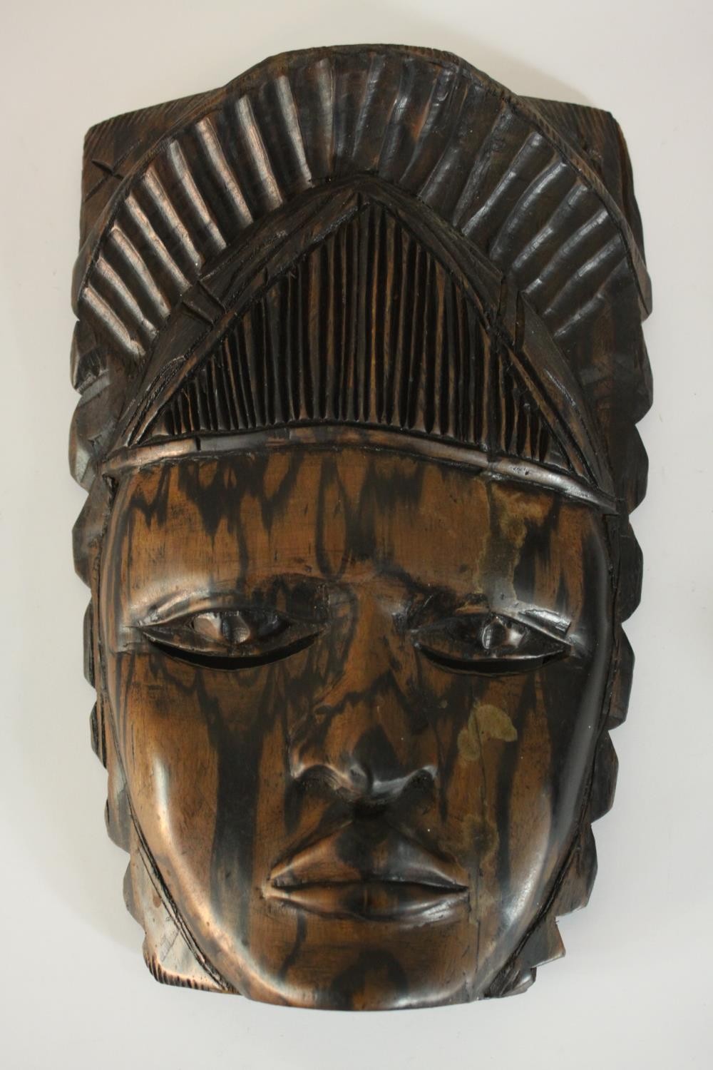 A carved African tribal mask along with a carved male bust in a hat and a double headed mask. H.27 - Image 4 of 8