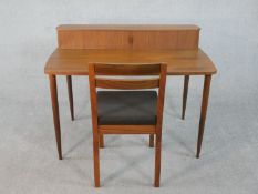 A vintage style De La Espada teak writing table with tambour shutter to the raised superstructure