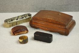 A 19th century papier mache snuff box along with an Art Nouveau foliate design clothes brush, horn