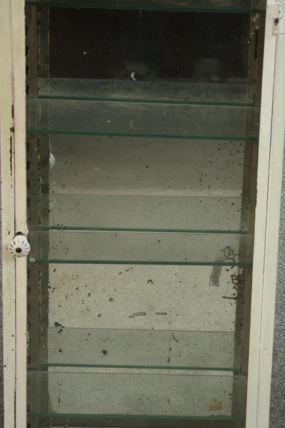 A white painted steel medicine cabinet, of slender form with a glazed door and sides, fitted with - Image 3 of 6