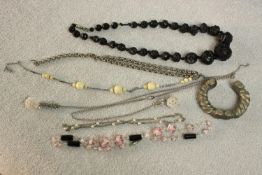 A collection of vintage jewellery, including a large Victorian carved jet bead necklace, a Czech