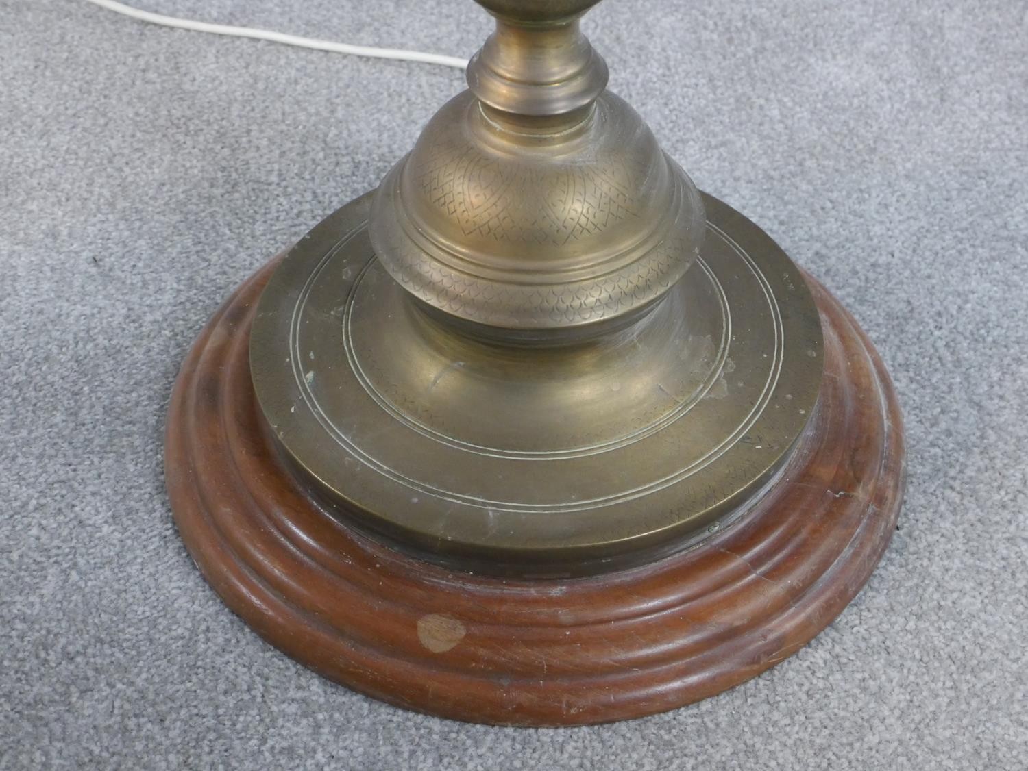 A 20th century turned brass standard lamp, on a circular base with a turned wood foot. H.164cm - Image 6 of 7