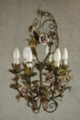 An early 20th century six branch toleware floral design chandelier with ceramic pink and yellow