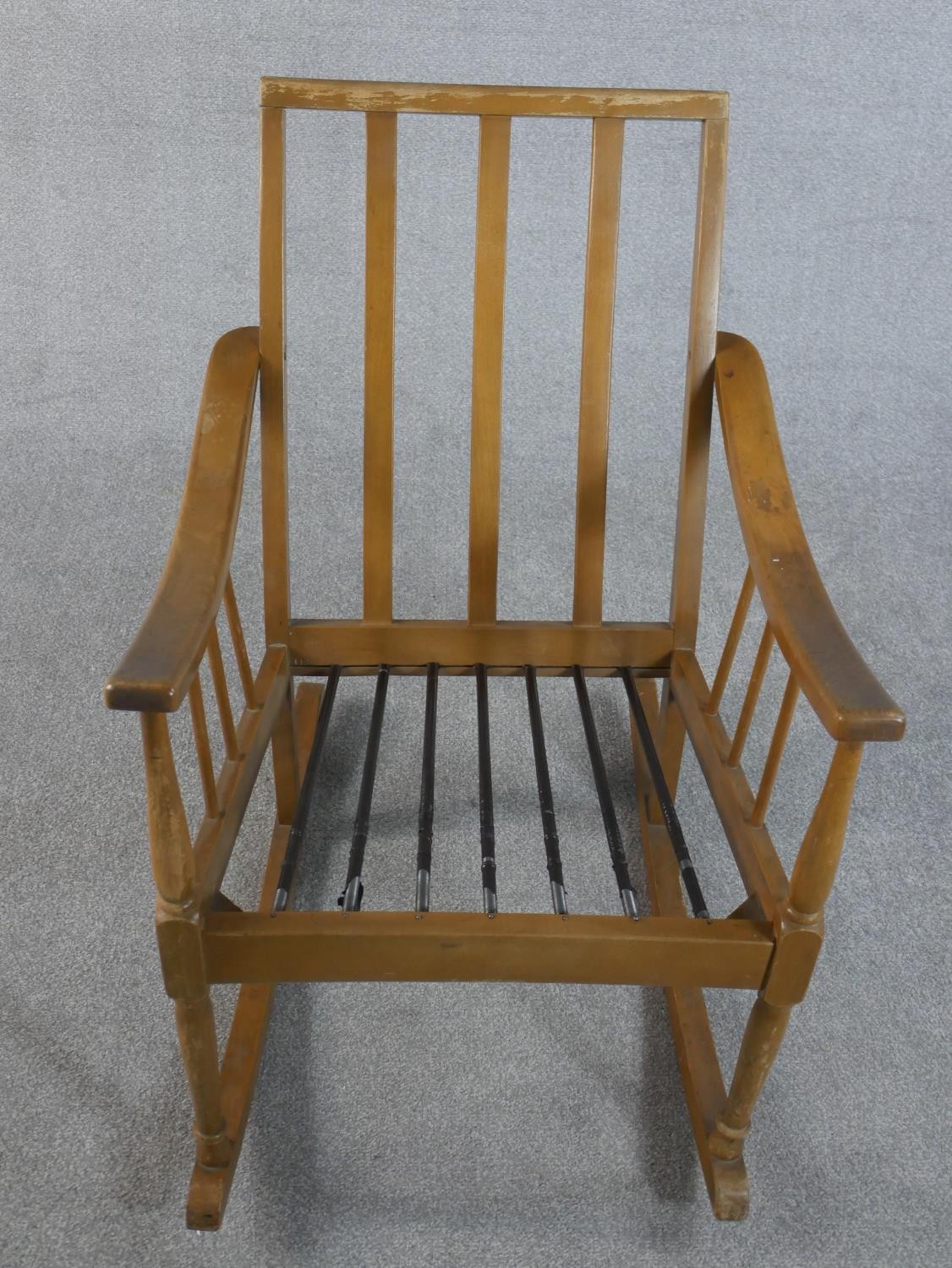 A mid 20th century beech rocking chair, with a spindle back and a blue upholstered loose cushion, on - Image 4 of 5