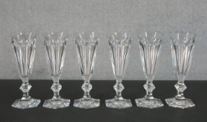 A set of six Baccarat crystal Harcourt pattern champagne flutes, 20th century, etched marks to base.