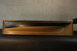 A shipbuilder's boat half hull model, painted and gilded, mounted on a rectangular mahogany backing.