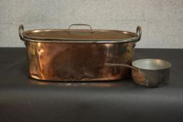 A Victorian copper fish kettle, with twin handles and a lid, the handle of the lid stamped 'H.A.