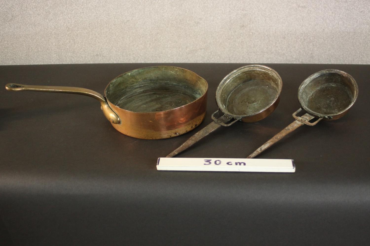 Three 19th century brass and copper pans. H.8 Dia.26cm. (largest) - Image 2 of 10
