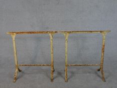 A pair of painted Victorian wrought iron table trestle ends. H.73 W.60 D.33cm