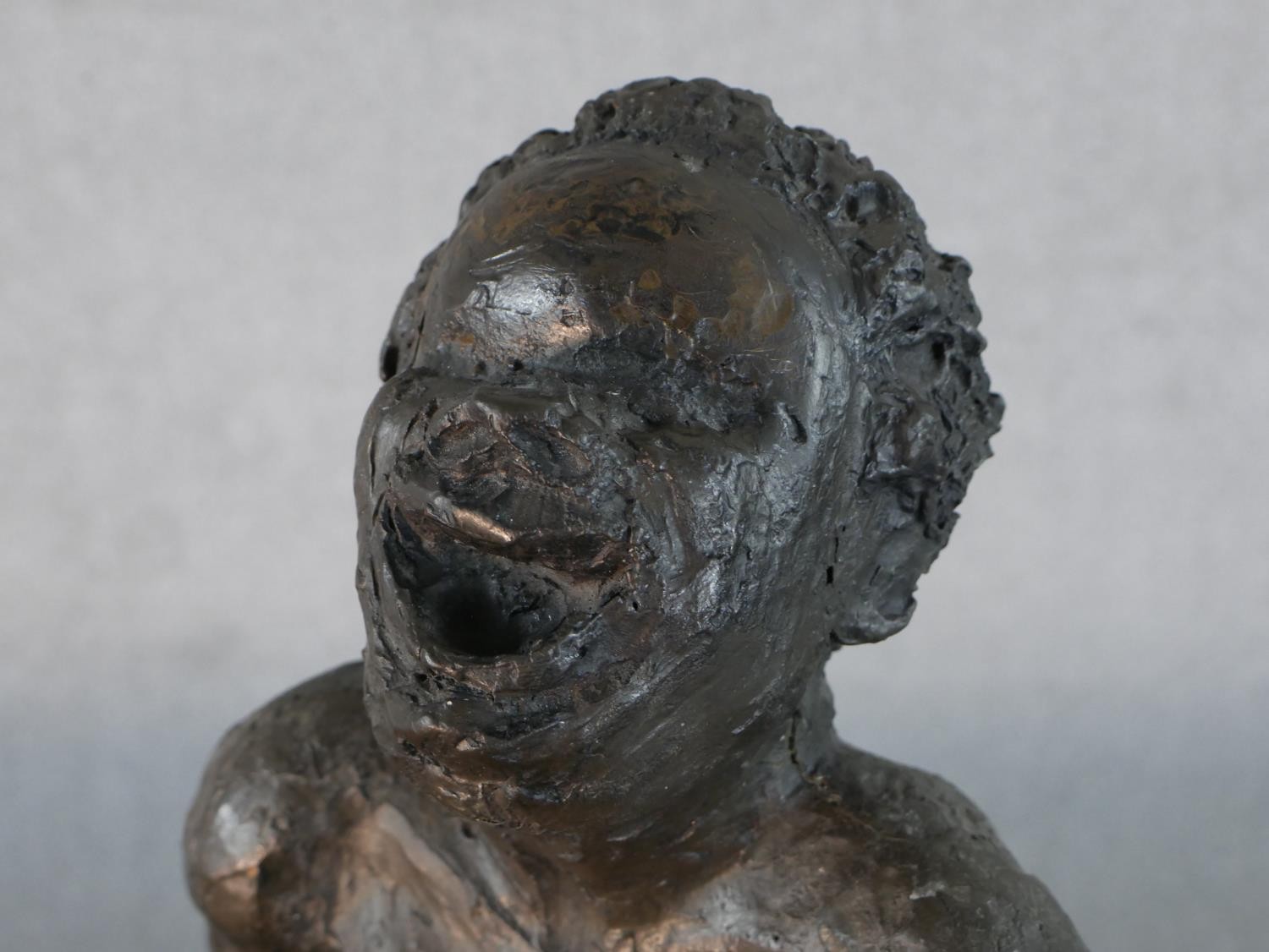 A bronzed moulded figure of a nude woman on a seat laughing, indistinctly signed. H.49 W.36 D.20cm - Image 6 of 6