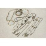 A collection of silver jewellery including, a silver snake chain, three silver bangles, various