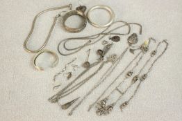 A collection of silver jewellery including, a silver snake chain, three silver bangles, various