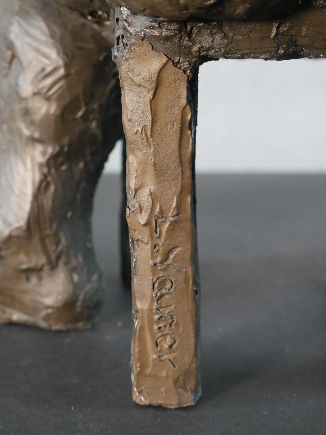 A bronzed moulded figure of a nude woman on a seat laughing, indistinctly signed. H.49 W.36 D.20cm - Image 4 of 6