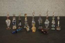 A collection of perfume and snuff bottles, including nine hand blown glass Egyptian bottles with