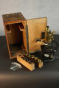 An early 20th century boxed students brass microscope by F. Koristka, Milan with spare lenses and