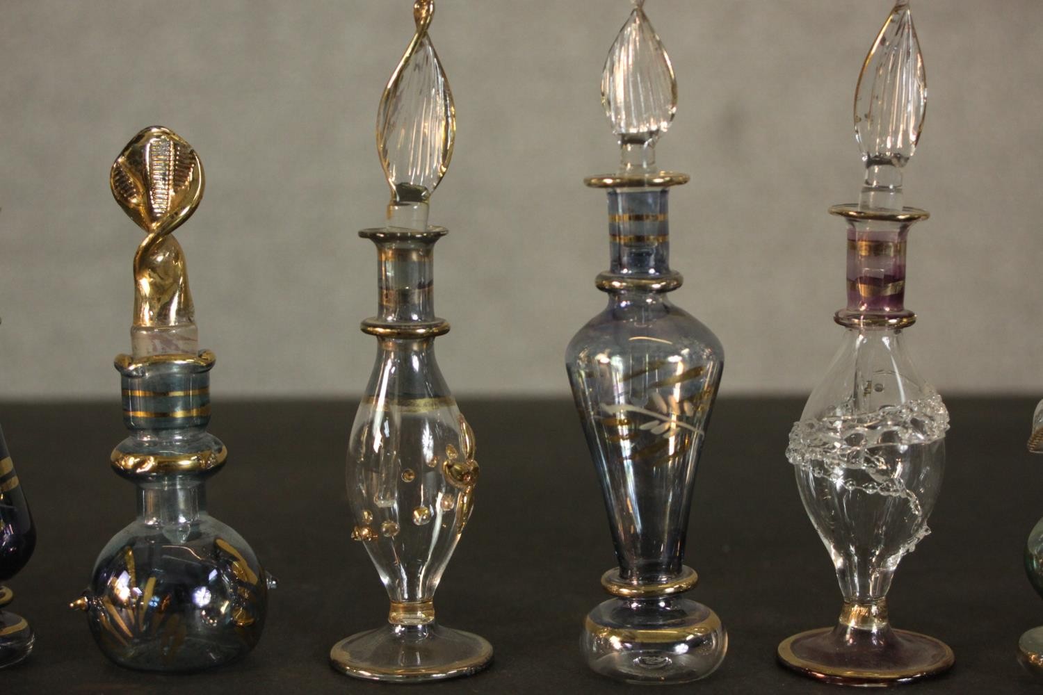 A collection of perfume and snuff bottles, including nine hand blown glass Egyptian bottles with - Image 5 of 11