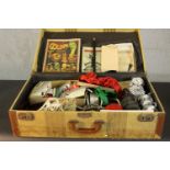 A large suitcase of vintage magic tricks. H.19 W.66 D.38cm. (case)