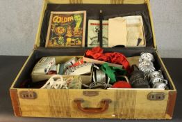 A large suitcase of vintage magic tricks. H.19 W.66 D.38cm. (case)