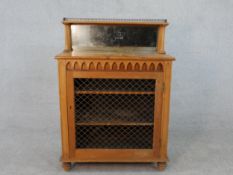 A mid 19th century pine pier cabinet with raised and glazed superstructure with original plate above