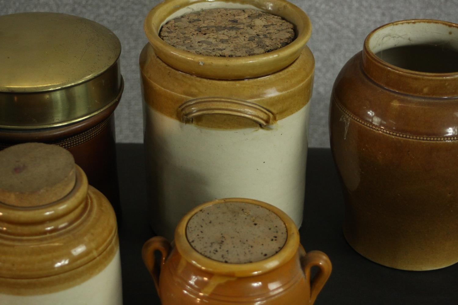 A collection of early 20th century honey glaze earthenware food storage jars, three with brass lids. - Image 3 of 8