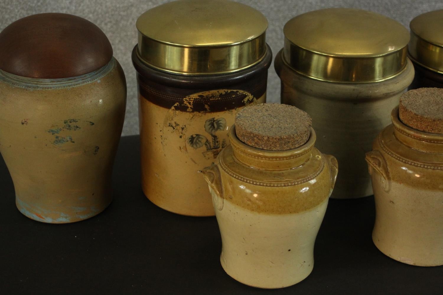 A collection of early 20th century honey glaze earthenware food storage jars, three with brass lids. - Image 5 of 8