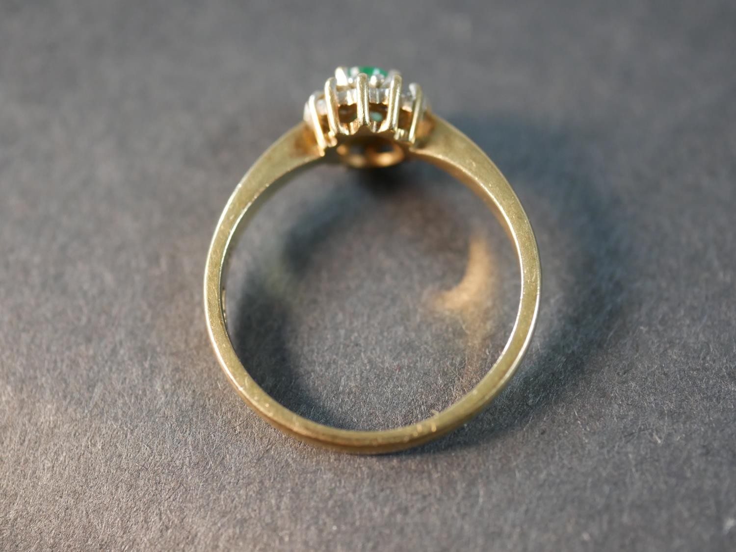 A 9 carat gold vintage emerald and diamond cluster ring, set to the centre with an oval mixed cut - Image 3 of 6