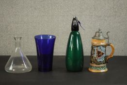 A German ceramic stein with lid along with a soda siphon and two glass items. H.33 Dia.10cm. (