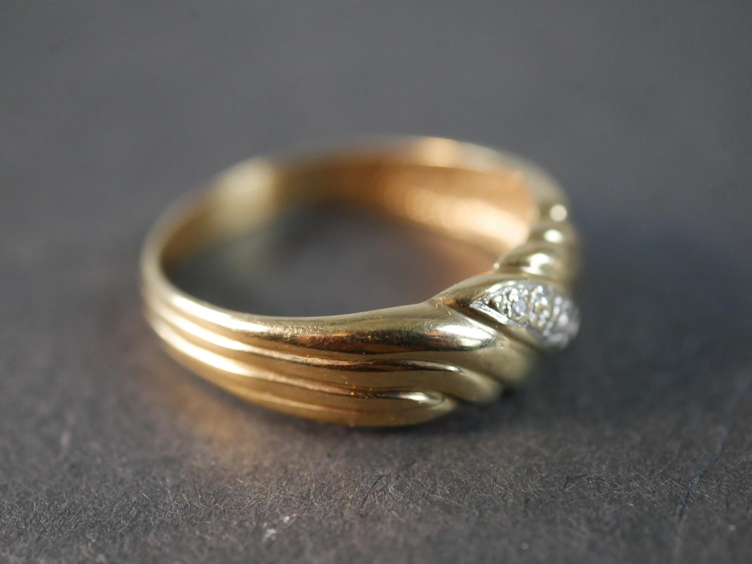 A 9 carat yellow gold and diamond band, set with five round eight cut diamonds with a combined - Image 5 of 7