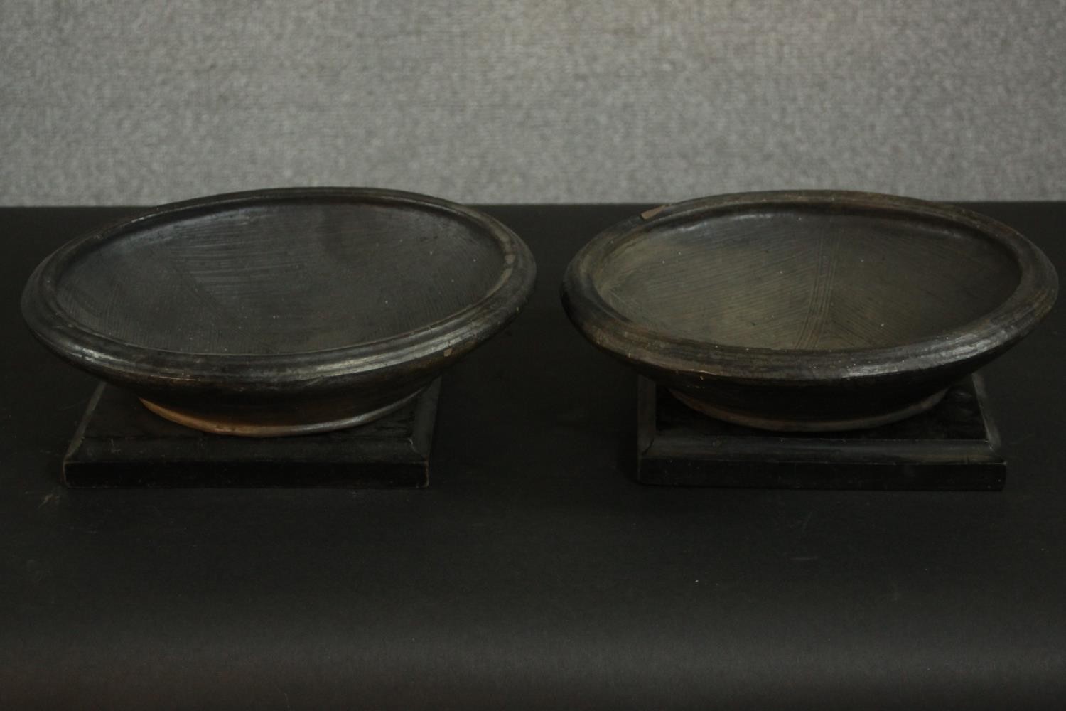 Two gold glaze art pottery bowls with two 19th century ebonised square stands. H.10 Dia.29cm. (each)
