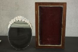 A barbola mirror, of circular form with a bevelled edge, the frame with white painted flowers on