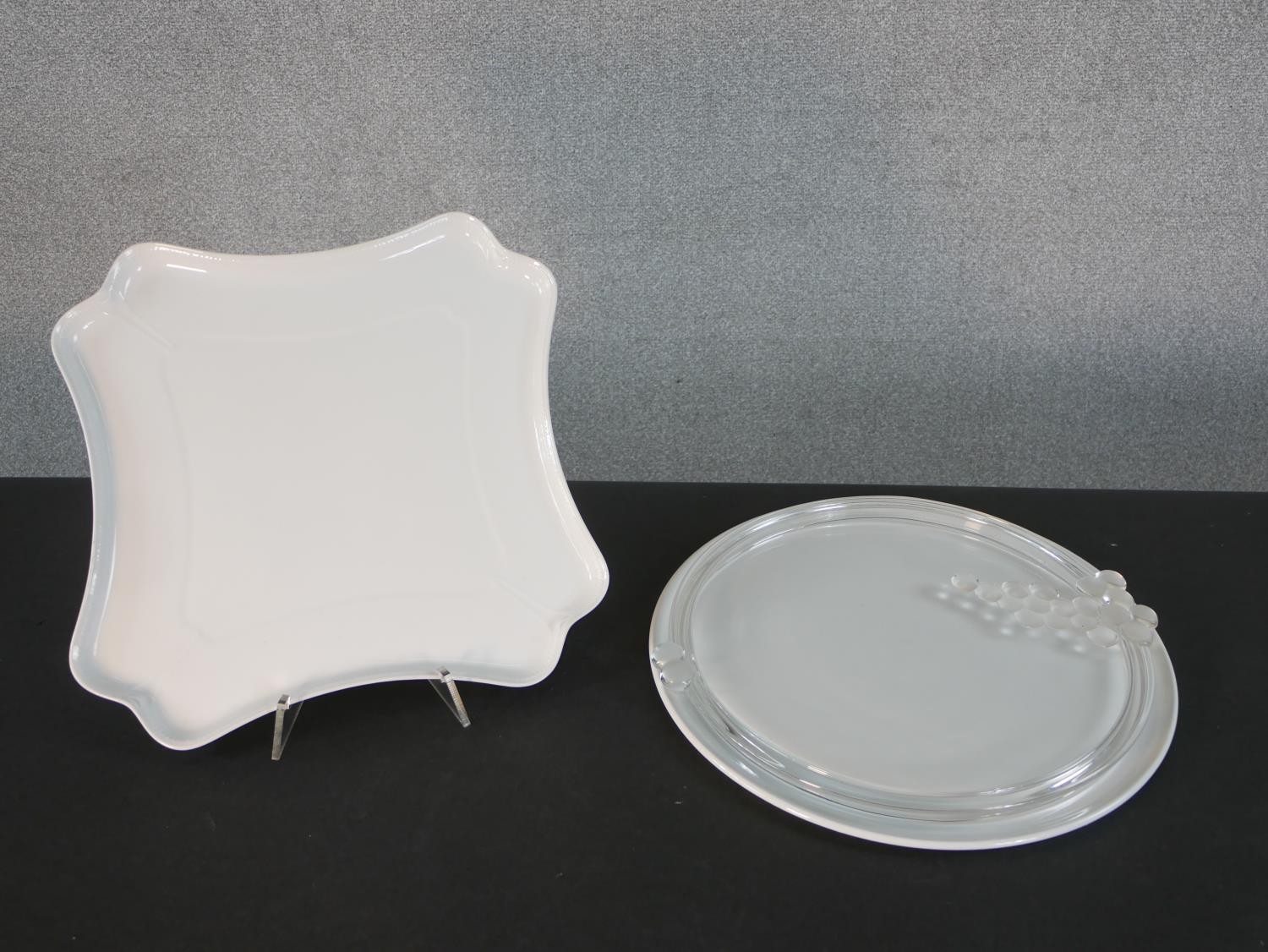 A Limoges porcelain cheese plate along with a glass cheese board with relief vine design. Diam. 36cm