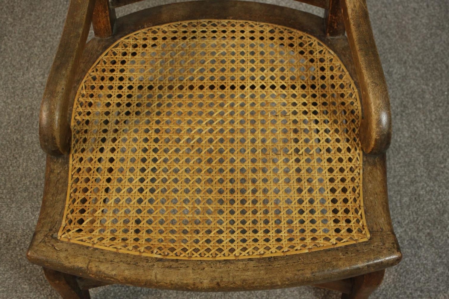 A circa 1900 hardwood nursing chair, with a caned seat and back, the legs joined by stretchers. - Image 7 of 7