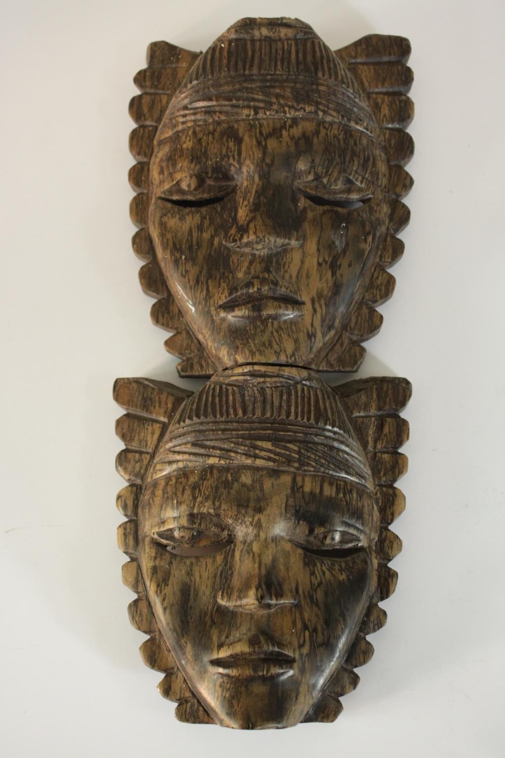 A carved African tribal mask along with a carved male bust in a hat and a double headed mask. H.27 - Image 3 of 8
