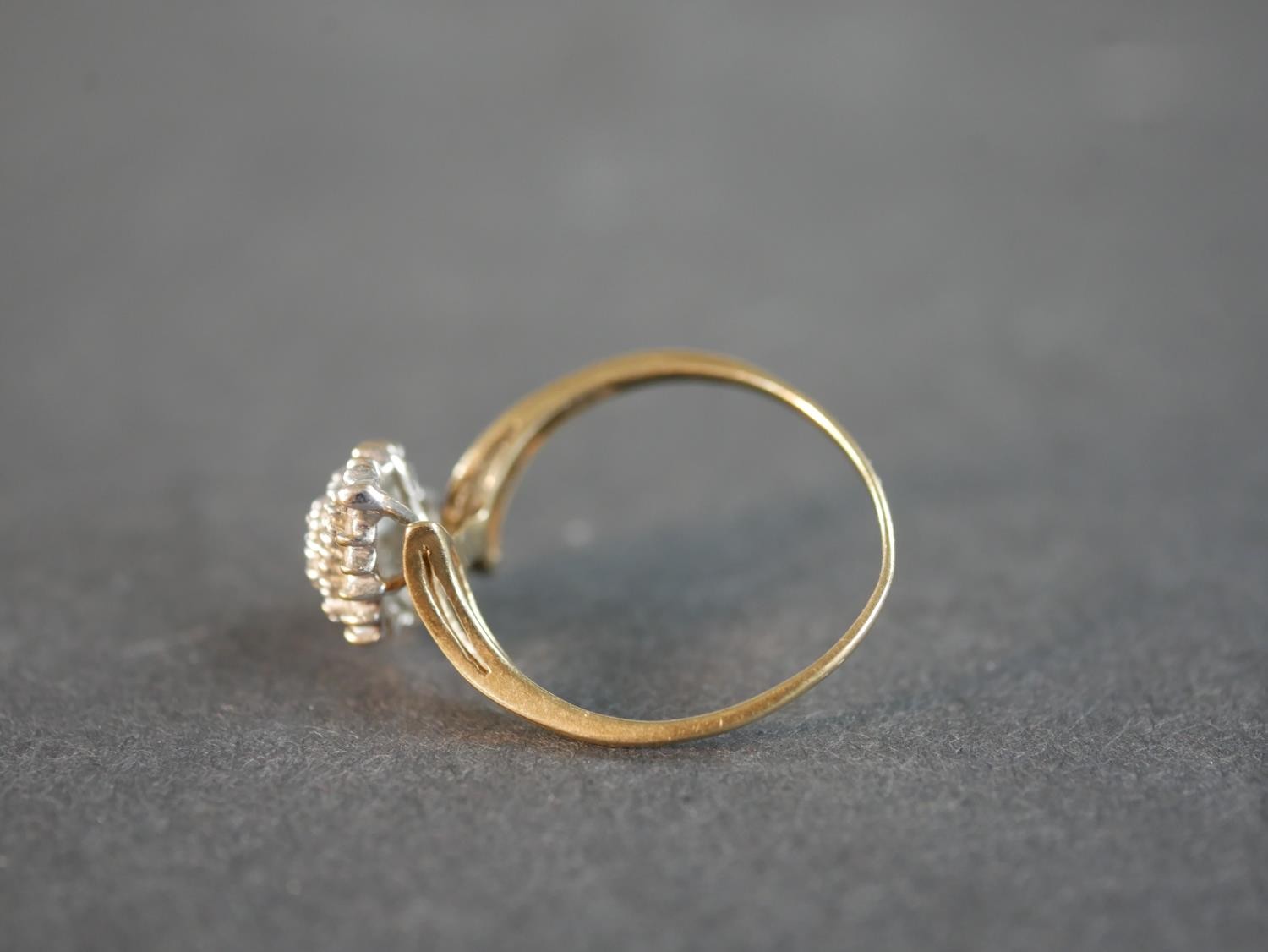 A 9 carat yellow gold and diamond cluster ring, set with thirty four round eight cut diamonds with a - Image 2 of 4