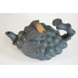 A Chinese black clay bunch of grape form tea pot with cicada finial. H.9 W.15 D.9cm.